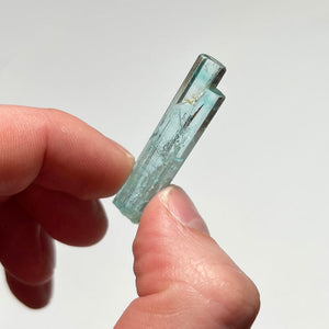 aquamarine beryl crystal in hand