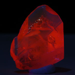 Fluorescent magnesium axinite crystal bright pink fluorescence