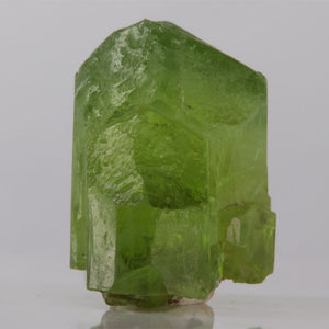 Green crystal on a gray background