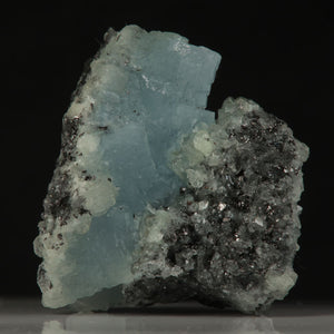 Blocky blue prehnite crystals displaying strong UV reaction