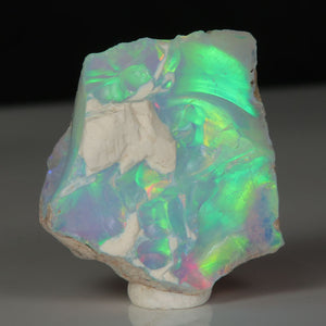 Ethiopian hydrophane opal rough with intense electric green play-of-color