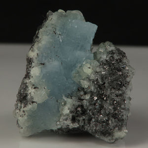 Fluorescent blue prehnite specimen from Tanzania under UV light