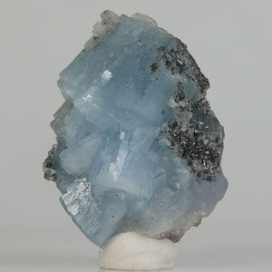 Fluorescent blue prehnite with tanzanite from Tanzania