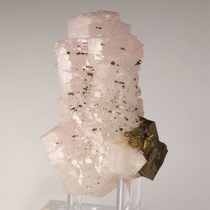 large pink calcite crystals with metallic pyrite