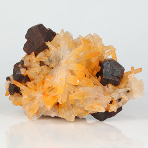 Quartz crystal cluster with weathered pyrite crystals