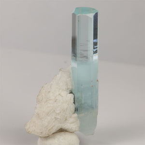 Natural Pakistani aquamarine displaying a clear hexagonal termination and delicate blue coloration.