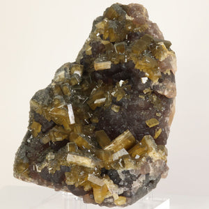 Lustrous tabular barite crystals covering fluorite matrix