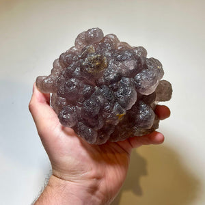 Dense purple fluorite crystal formation with rounded growth