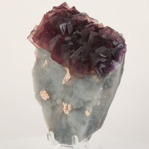 Dark purple fluorite crystal formation on natural matrix