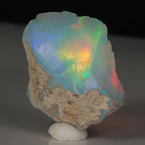 Ethiopian opal specimen with green, red, and violet play-of-color