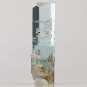 Natural 13.71 gram aquamarine crystal from Skardu Valley featuring a slender hexagonal shape.