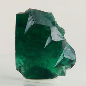 Deep emerald-green Rogerley Mine fluorite specimen weighing 34.36 grams with intergrown cubic crystals and sharp edges.
