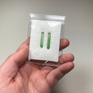similar green tourmaline crystals elongated prismatic form