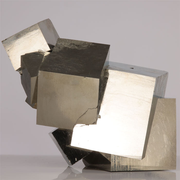 Metallic pyrite crystal cubes in a cluster