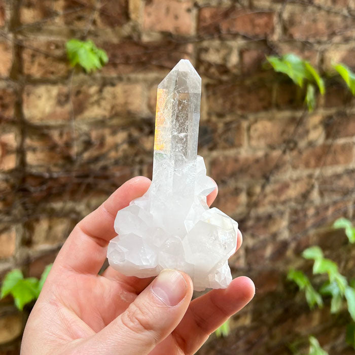 Tall clear quartz crystal specimen
