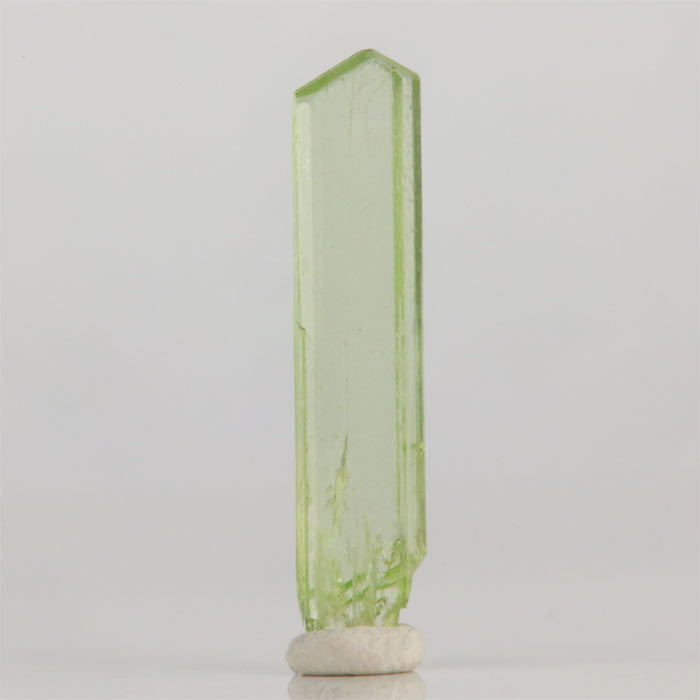 Green diopside crystal from Tanzania long slender mineral specimen