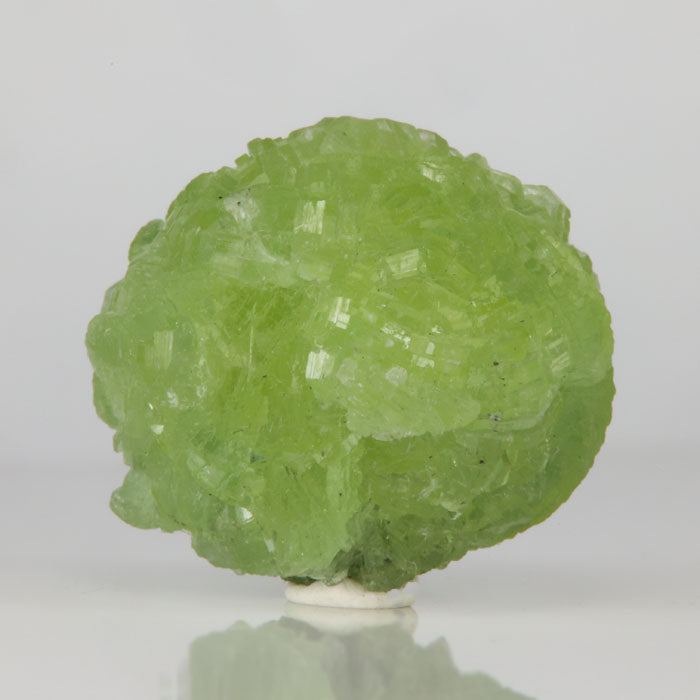 Prehnite crystal cluster from Tanzania with vibrant green color