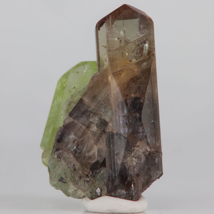 Brown and blue violet tanzanite with green diopside mineral specimen
