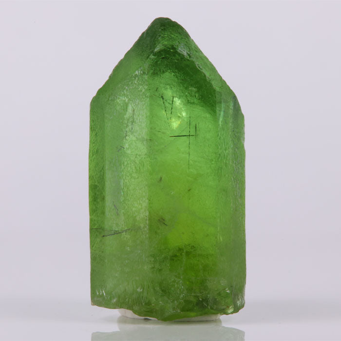 Gemmy peridot crystal from Pakistan bright green natural specimen