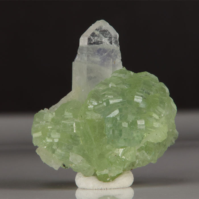 Apple green prehnite mineral with clear quartz crystal detail