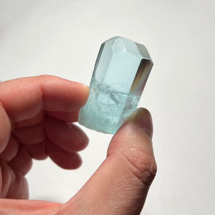 Teal crystal on a white background