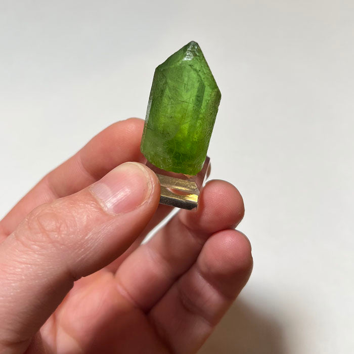 Gemmy peridot crystal from Pakistan bright green natural specimen