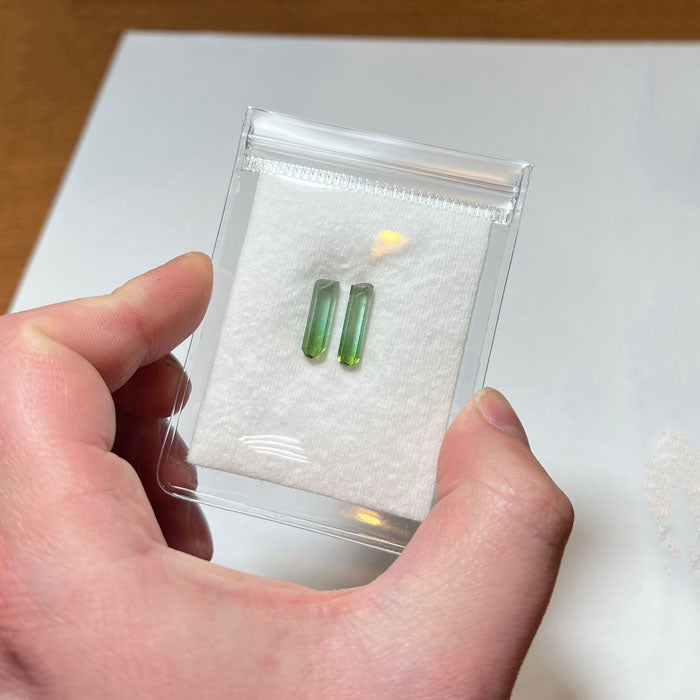 Pair of green tourmaline crystals matching size for jewelry or collectors