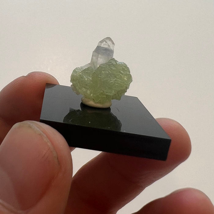 Prehnite and quartz mineral specimen from Tanzania with green crystal cluster