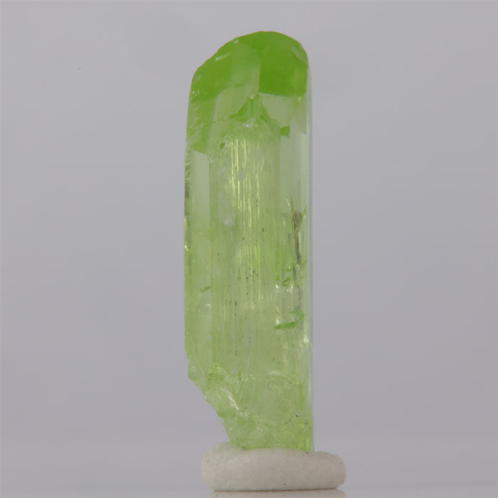 Green crystal on a white background