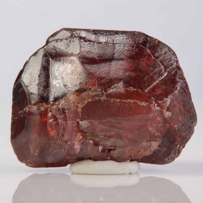 Raw red zircon crystal specimen