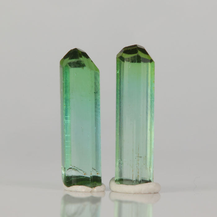Natural green tourmaline crystal pair elongated matching specimens