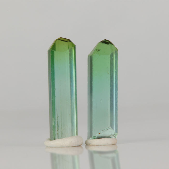 Matched green tourmaline crystal pair from Congo slender natural crystals