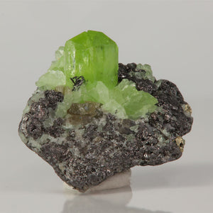 Green diopside crystals on graphite matrix Tanzania mineral specimen