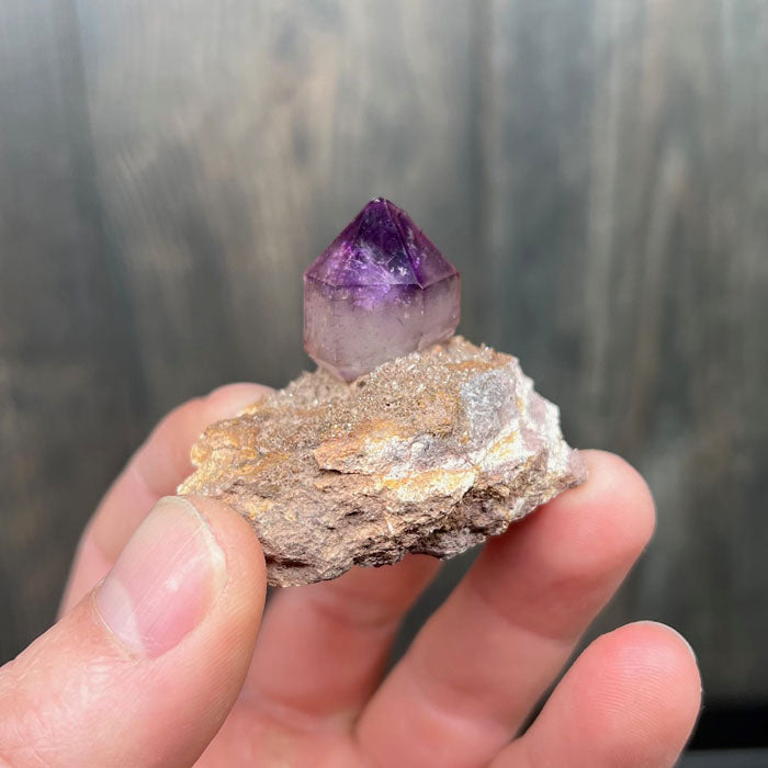 amethyst crystal on host rock