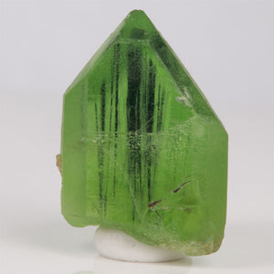Minty green peridot crystal with ludwigite inclusions