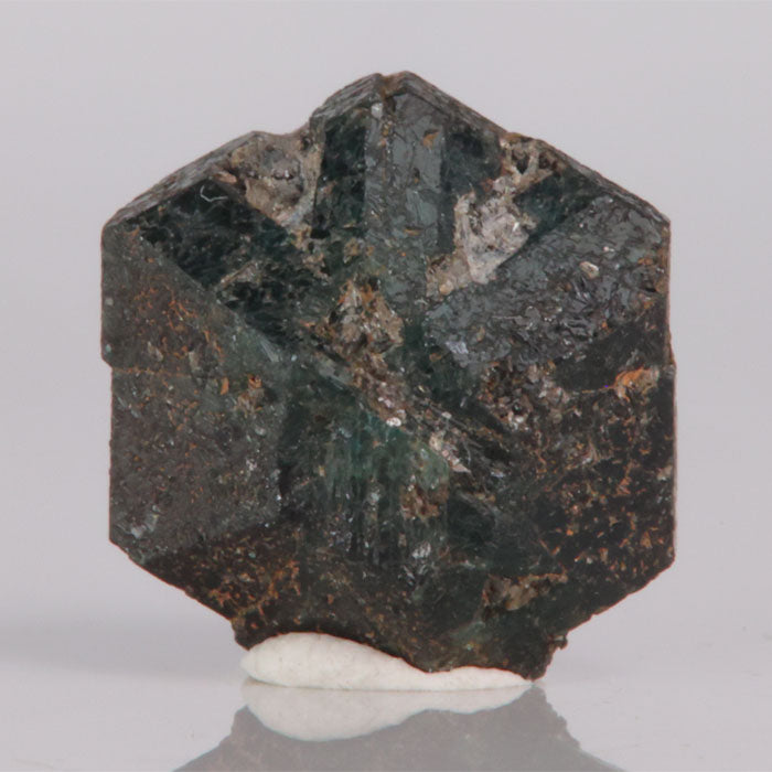 Hexagonal Alexandrite mineral specimen on a white background