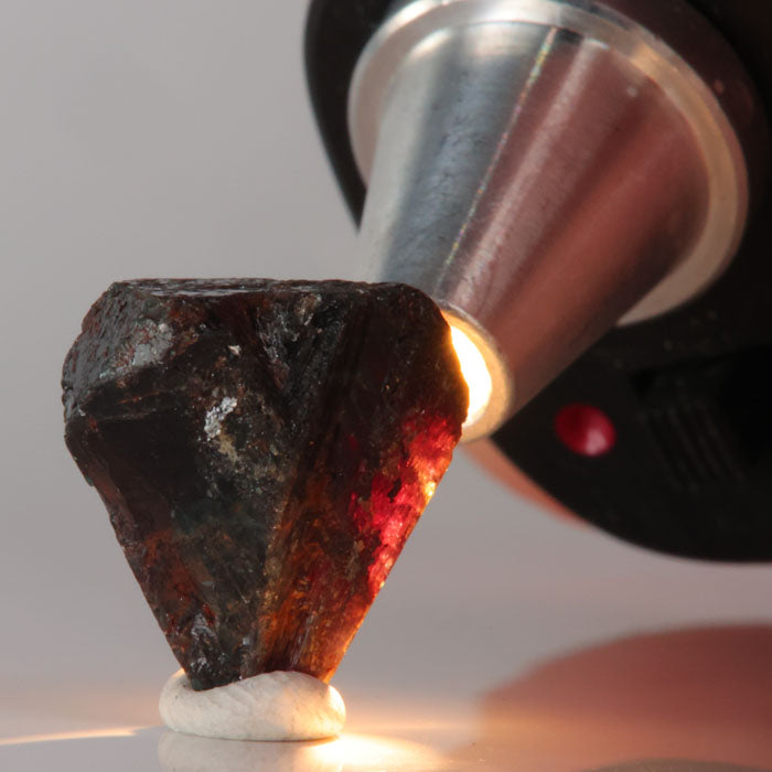 Alexandrite Mineral sample being examined under a magnifying lamp