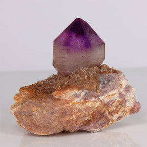 host rock with natural amethyst crystal