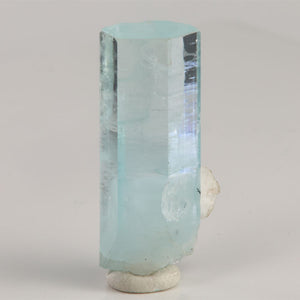 Reverse view of aquamarine from Skardu Valley featuring transparent upper faces and a frosted blue crystal base.