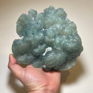 translucent fluorite specimen with rounded crystal formations from China