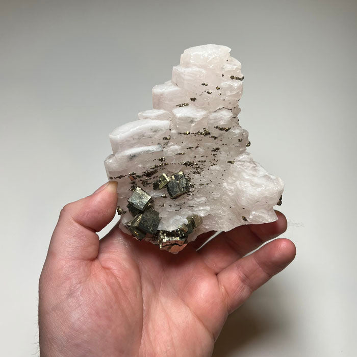 pink calcite with pyrite crystals Longyan China specimen