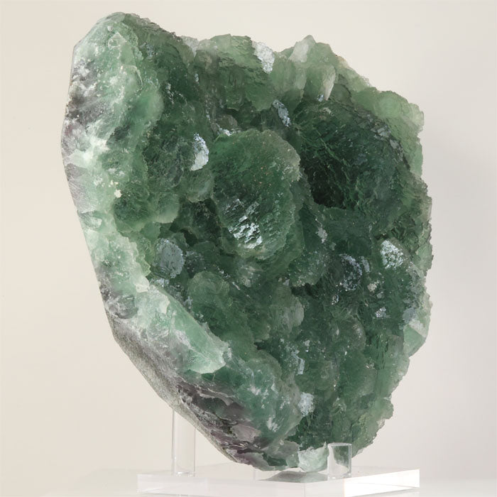oversized fluorite display piece featuring layered green crystal structures