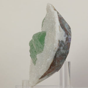 Large Chinese fluorite specimen with white druzy coating