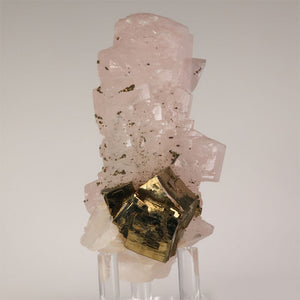 fluorescent calcite crystal with pyrite cube