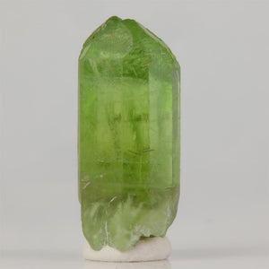 Collector peridot specimen with bright green color and matrix base