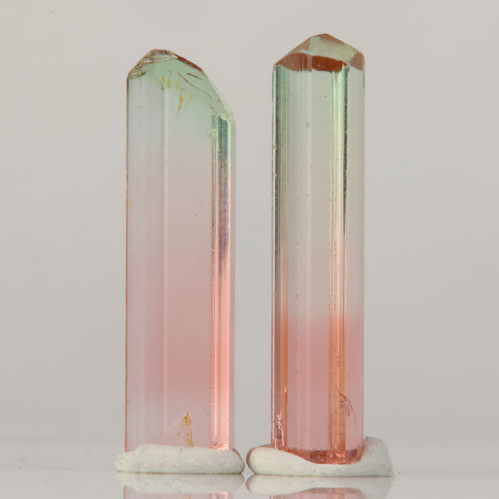 elongated tourmaline crystal pair africa bi color mineral specimen