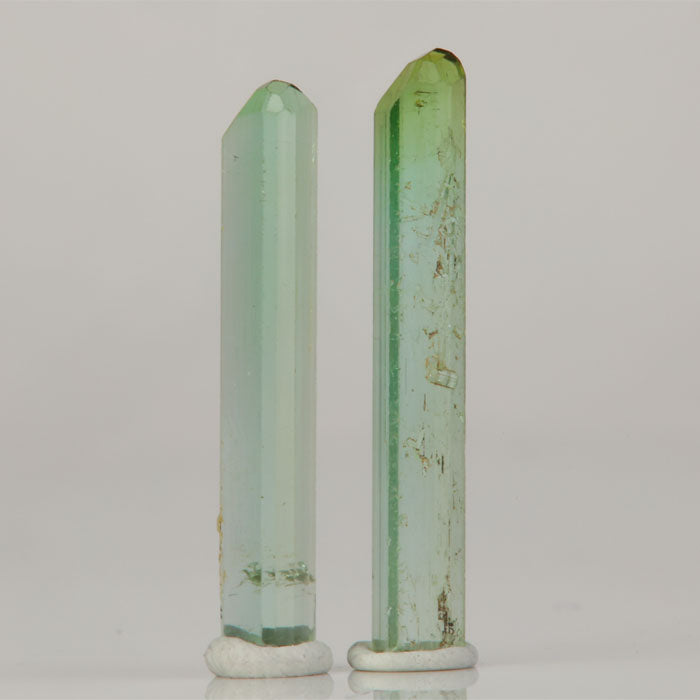 pair of light green tourmaline crystals from Congo elongated shape