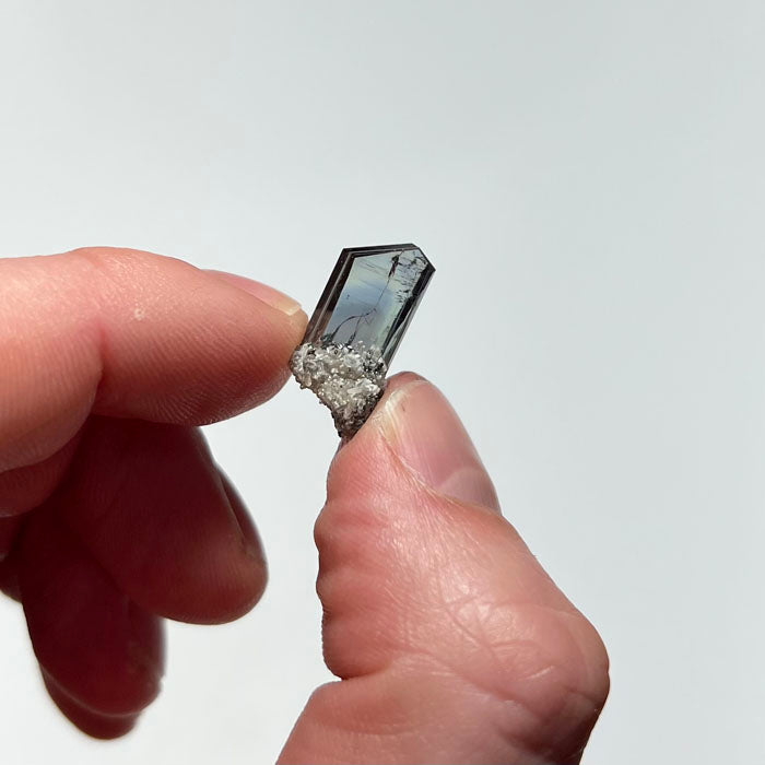 tanzanite crystal in hand