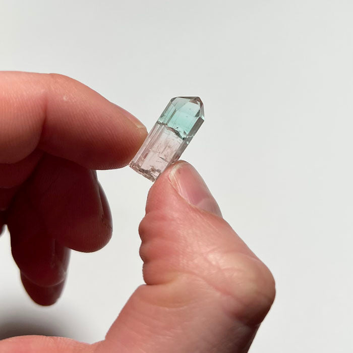 tourmaline crystal in hand