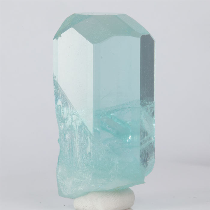 Teal crystal on a white background